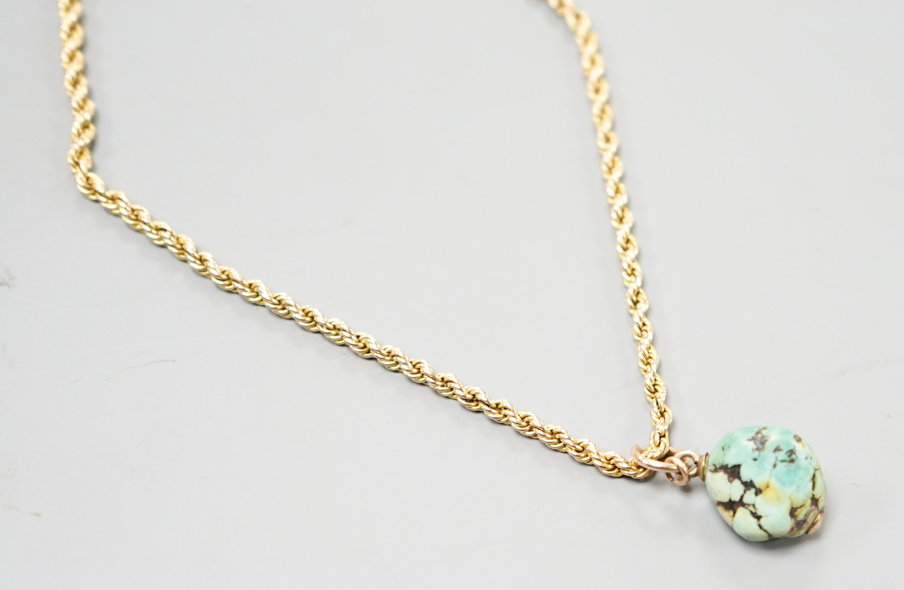 A 9ct rope twist guard chain, with turquoise pebble pendant, chain length, 146cm